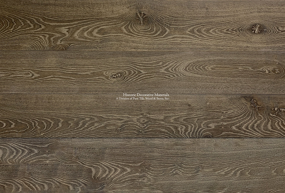 Elegant Farmhouses install aged French oak floors that are slightly wired brush.