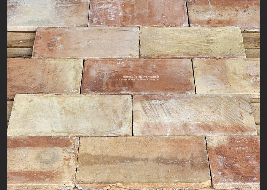 Seeing hand marks of the artisan is common on French reclaimed terra cotta tile parefeuille.