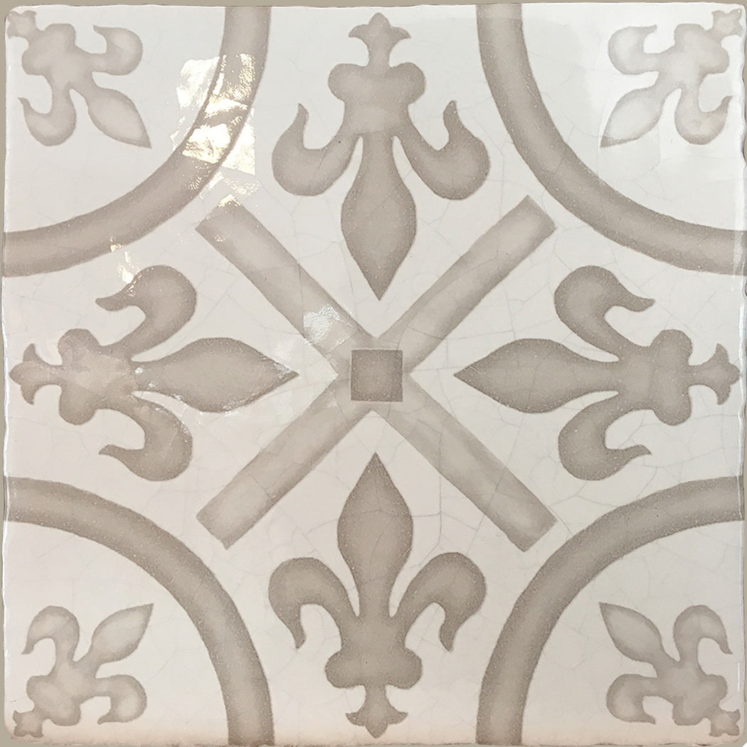 Hand painted encaustic fleur de lys wall tiles for powder room interior
