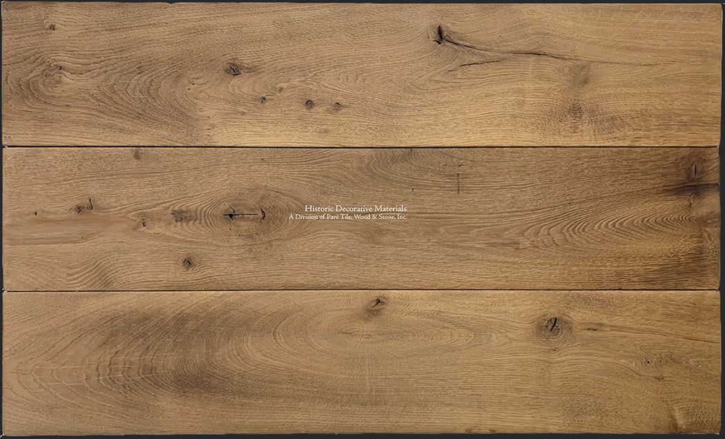 Hand-finished, these wide plank 200-year old French oak floors complete historic, luxury interiors.
