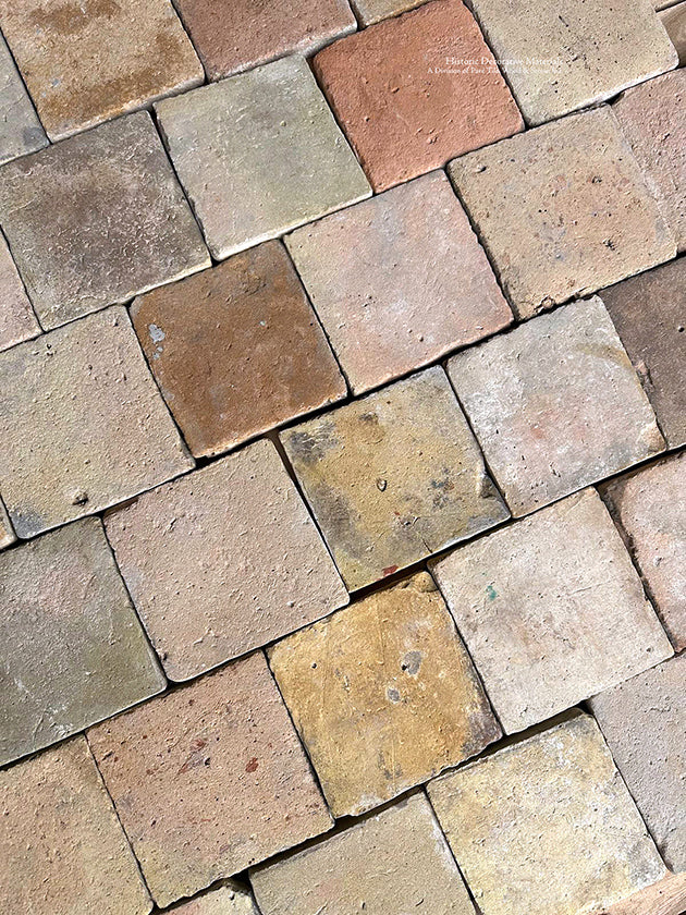 Walking on this antique French terra cotta tile cobblestone floor will transport you back to the 18th century.