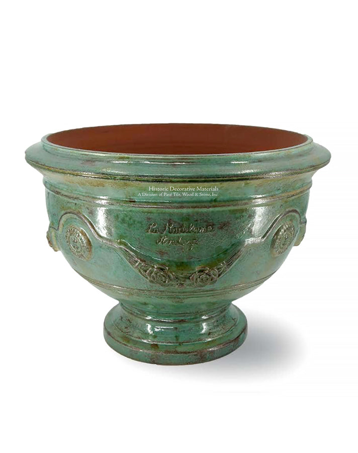 The copper glaze color of this coupe d'Anduze from Provence mirrors the beauty of an historic, copper roof.