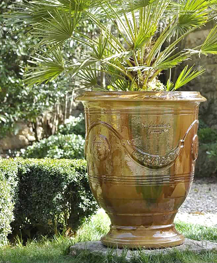 The brilliant earth toned glazes of this vintage French pottery from Provence adds elegance to gardens.