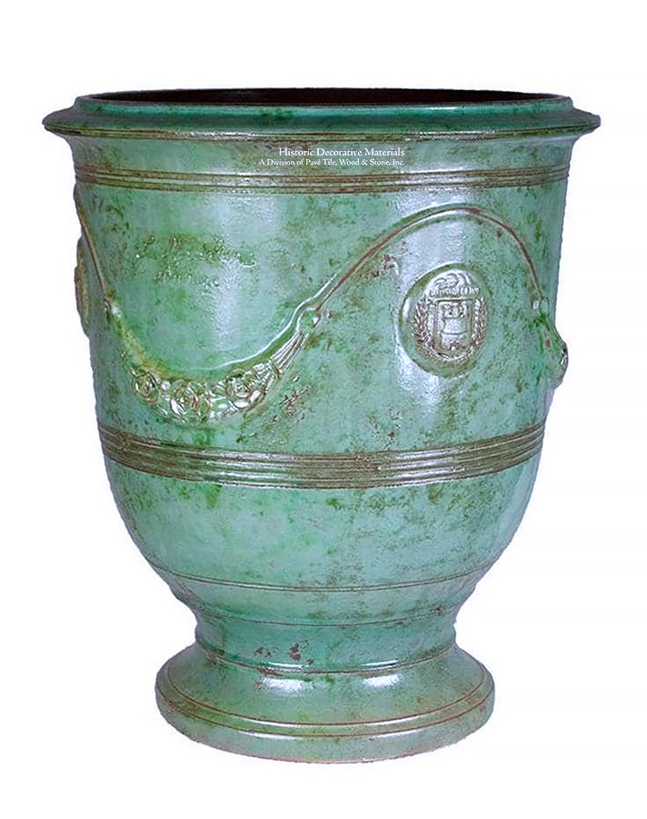 The historic copper patina of this decorative ceramic Anduze vase from Provence showcases French garden design.