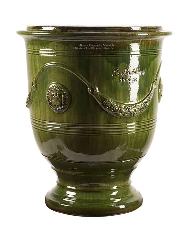 A beautiful thyme green glaze enhances the beauty of this Anduze French pottery from Provence.
