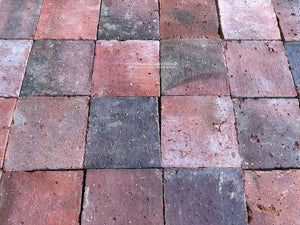 Reclaimed French terra cotta tile with historic pitting, wear and color variation