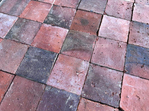Reclaimed French terra cotta tiles with deep burgundy and charcoal firing marks
