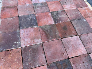 Reclaimed French terra cotta flooring with irregular edges and centuries-old character