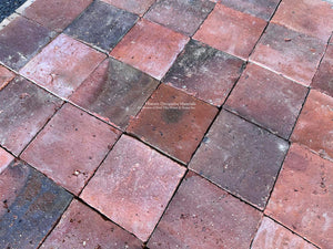 Reclaimed French terra cotta tiles with naturally mottled red and aubergine color