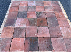 Reclaimed French terra cotta tile with rustic texture and deep brick-red coloration