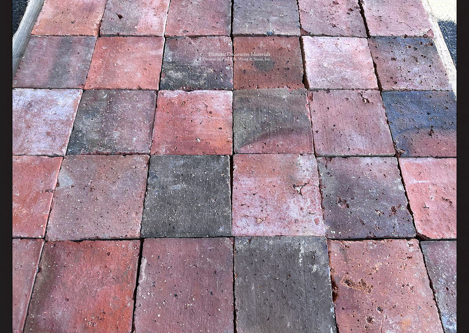 Reclaimed French terra cotta tile with century-old surface wear and rich red, pink and black patina
