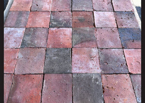 Reclaimed French terra cotta tile with century-old surface wear and rich red, pink and black patina