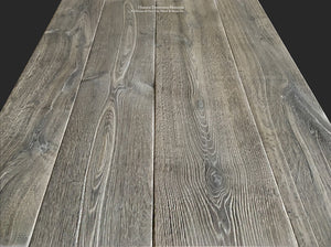 Magnificent patina of a vintage gray reclaimed French oak floor anchors an historic country house.