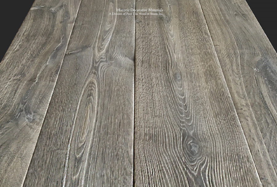 Reclaimed French oak floors in a vintage gray patina is forever classic in historic interiors.