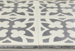 Antiqued by hand to accelerate the surface of the cement tile into a satin patina