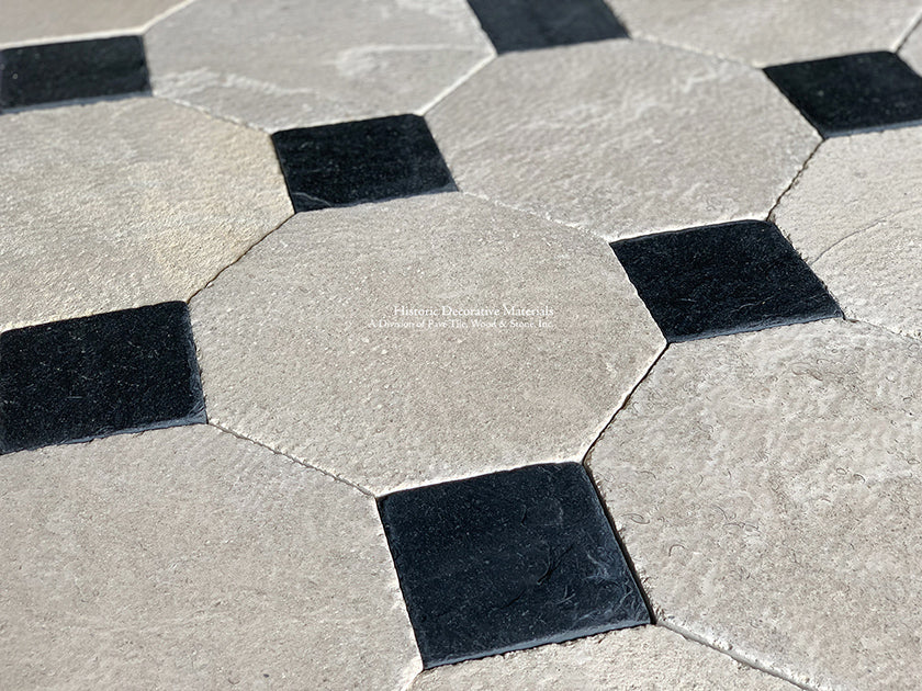 Warm beige antique French limestone octagon with black cabochon makes a striking  historic floor.