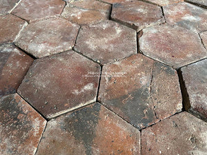 Le Port de la Lune French Reclaimed Terra Cotta Tile Hexagon - the decorative black flashing marks come from the flames of the wood-burning kilns touching the tiles while they are being fired.