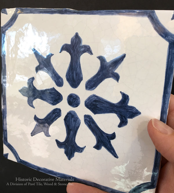 Hand painted decorative walls tiles for a kitchen backsplash is lovely