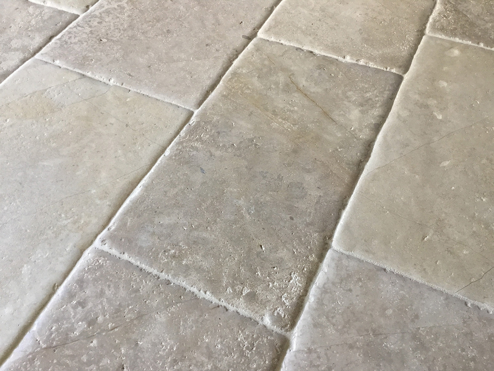 The artisanal craftsman ship of our hand-finished antique French limestone floor becomes jewelry for your floor.