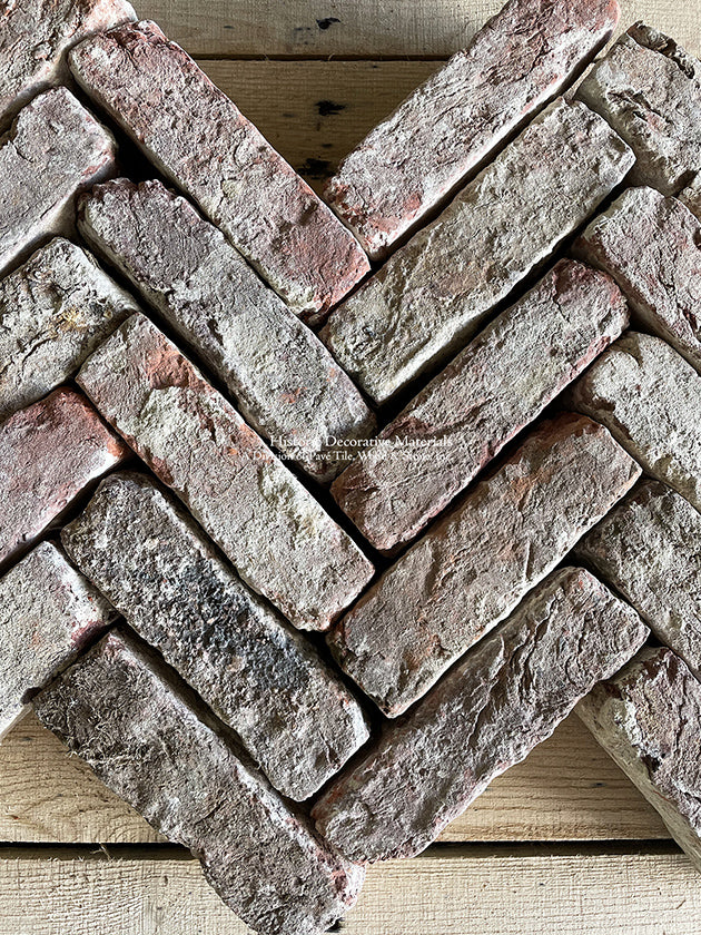 Reclaimed Antique Belgian Red Bricks installed in a chevron pattern holds the eye.