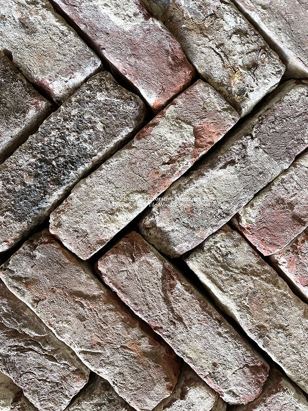 The texture and patina of Reclaimed Antique Belgian Red Bricks arises from centuries of wear.