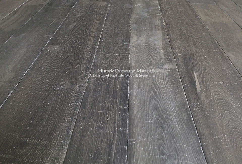 A soft charcoal hue patina defines this reclaimed and aged French oak floor.