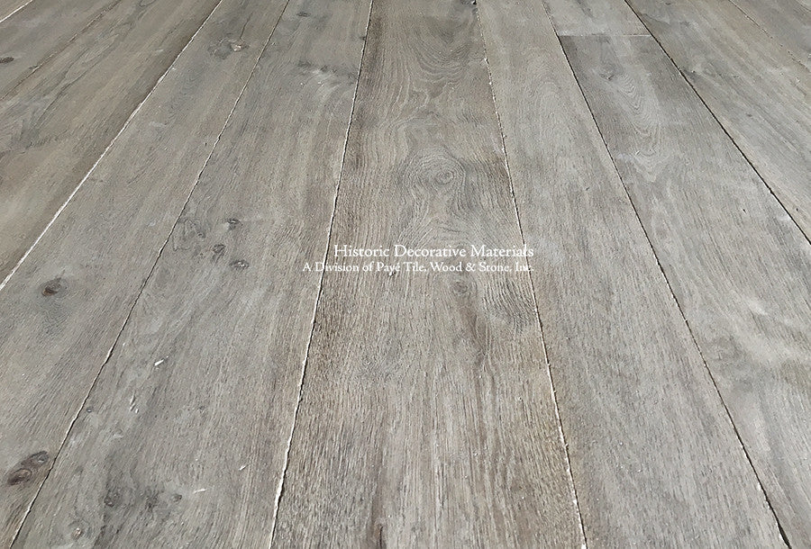 Weathered gray French oak flooring is pre-finished using a 7-10 step[ oxidation process.